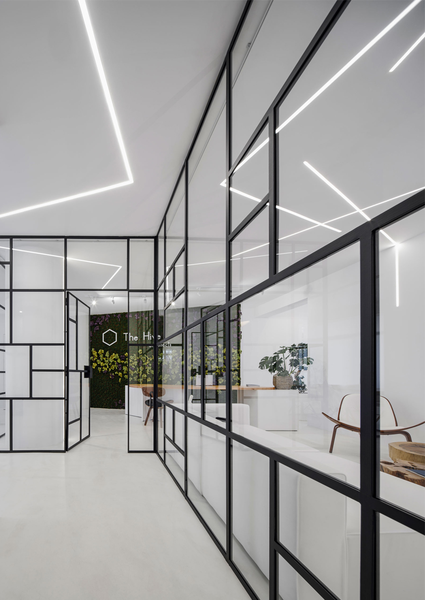 architect office work space glass interior design white light the hive architects