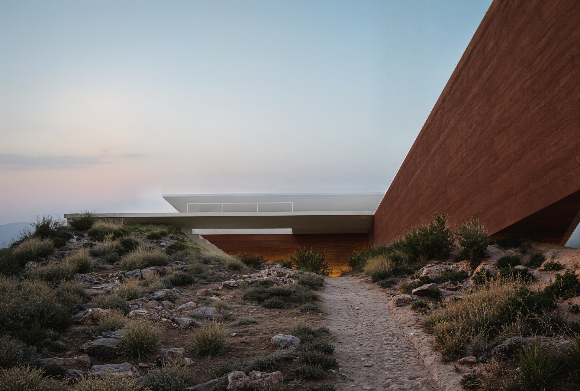 Ovidium House material details – Travertine, rammed earth, and white plaster harmoniously combined.